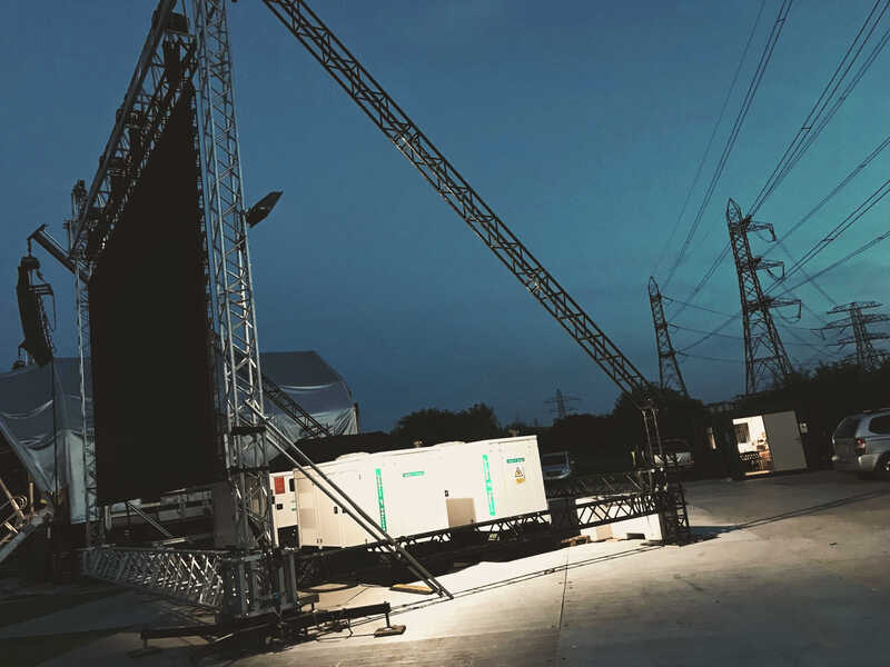 Generator and large screen at outdoor event